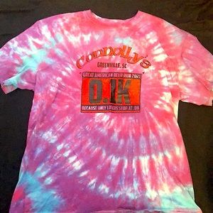 Never worn shortsleeved tee in a tie dye pattern in purple and blue